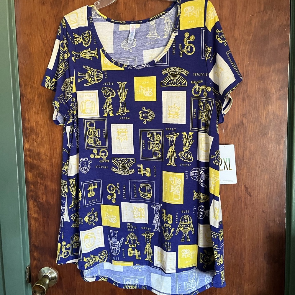 LuLaRoe Navy Blue and Yellow Graphic Pocket Tee